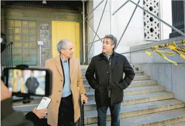  ?? JEFFERSON SIEGEL/THE NEW YORK TIMES ?? Trump’s ex-lawyer Michael Cohen, right, arrives at the Manhattan DA’s office Tuesday.
