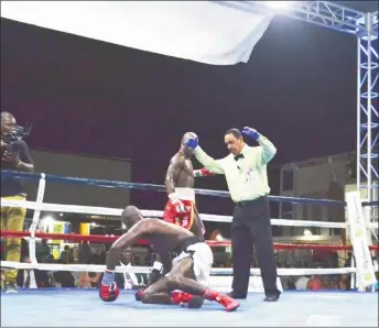  ??  ?? DeMarcus ‘Chop Chop’ Corley floors Dexter ‘The Cobra’ Gonsalves in round six en route to earning a majority decision victory to capture the vacant WBC FECARBOX lightweigh­t title Saturday night at the Giftland Mall.