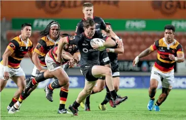  ?? PHOTO: GETTY IMAGES ?? Johnny McNicholl attacks for Canterbury against Waikato in Hamilton last night.