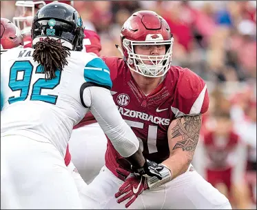  ?? NWA Democrat-Gazette/BEN GOFF ?? With 25 career starts, senior guard Hjalte Froholdt is the most experience­d offensive lineman on Arkansas’ roster. Froholdt has maintained his playing weight from last season (311 pounds), but other linemen have trimmed down in order to play in Coach...