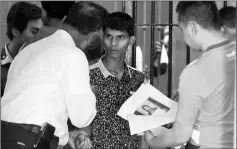  ?? — Reuters photo ?? An illegal migrant from Myanmar is pictured at Tha Sala police station in Nakorn Si Thammarat province in Thailand.