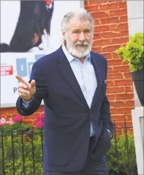  ?? Lisa O’Connor / AFP/Getty Images ?? Actor Harrison Ford walks the carpet at the “The Secret Life of Pets 2” Los Angeles Premiere at Regency Village Theatre on June 2 in Westwood, Calif.