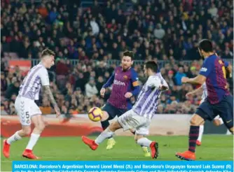  ?? — AFP ?? BARCELONA: Barcelona’s Argentinia­n forward Lionel Messi (2L) and Barcelona’s Uruguayan forward Luis Suarez (R) vie for the ball with Real Valladolid’s Spanish defender Fernando Calero and Real Valladolid’s Spanish defender Kiko Olivas during the Spanish League football match between Barcelona and Real Valladolid at the Camp Nou stadium in Barcelona on Saturday.