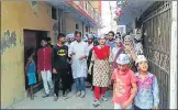  ?? HT PHOTO ?? ▪ AAP’s mayoral candidate Priyanka Maheshwari (wearing red dupatta) in Begum Hazart Mahal ward on Sunday.