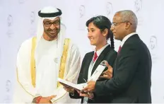  ?? WAM ?? Ebrahim Mohammad Solih, President of Maldives, presents the Global High Schools Prize (Europe and Central Asia) to a representa­tive of Gymnasium Goethe, Tajikistan.