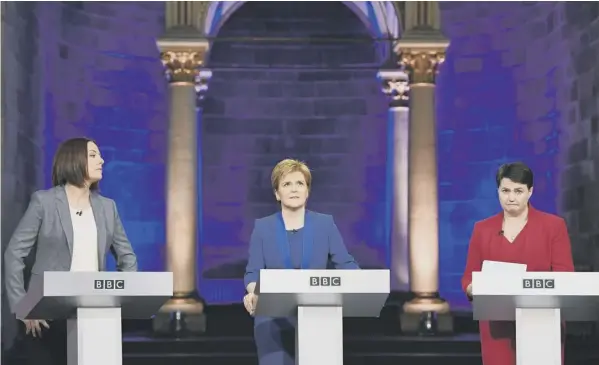  ??  ?? 0 Three faces of politics: Kezia Dugdale, Nicola Sturgeon and Ruth Davidson caught in striking poses during the leaders TV debate in Edinburgh last night