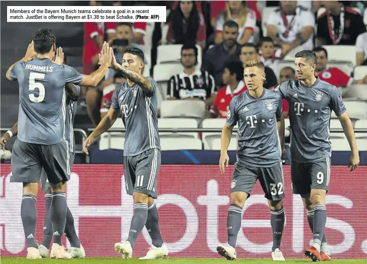  ?? (Photo: AFP) ?? Members of the Bayern Munich teams celebrate a goal in a recent match. Justbet is offering Bayern at $1.38 to beat Schalke.