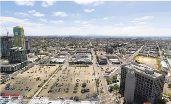  ?? K.C. ALFRED U-T FILE ?? The Padres’ $1.4 billion plan seeks to refashion Tailgate Park, an asphalt area bounded by 12th and Imperial avenues, and K and 14th streets, into a commercial office hub now being referred to as East Village Quarter.