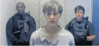  ??  ?? HATE CRIME: In this image from the video uplink from the detention centre to the courtroom, Dylann Roof appears at Centralise­d Bond Hearing Court June 19, 2015 in North Charleston, South Carolina charged with nine counts of murder and firearms charges.