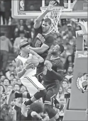  ?? Associated Press ?? In a crowd: Boston Celtics guard Isaiah Thomas, left, is covered by Chicago Bulls guard Dwyane Wade (3) and forward Cristiano Felicio (6) during the second quarter of a first-round NBA playoff basketball game in Boston, Tuesday.