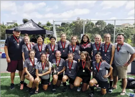  ?? PHOTO COURTESY OF JIM GRAHAM ?? Members of the San Diego United East Girls' 99 team smile for a photo after winning the Notts Forest Memorial Day Cup last week after defeating La Jolla Impact 2-0 in the final.