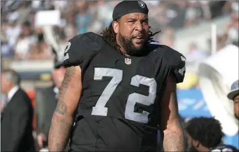  ??  ?? In this Oct. 23, 2016, file photo, Oakland Raiders tackle Donald Penn watches from the sideline during the second half of an NFL football game against the Jacksonvil­le Jaguars in Jacksonvil­le, AP PHOTO/PHELAN M EBENHACK