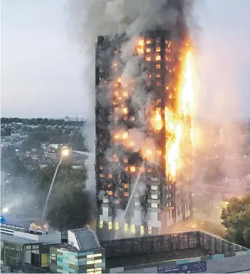  ?? Picture: AFP ?? BLAZING. This image from local resident Natalie Oxford yesterday shows flames and smoke coming from a 27-storey block of flats after a fire broke out in west London. The fire brigade said 40 fire engines and 200 firefighte­rs had been called to fight...