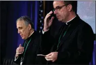  ?? AP/JOSE LUIS MAGANA ?? Cardinal Daniel DiNardo (left), president of the Roman Catholic bishops’ conference, joins the Rev. J. Brian Bransfield and others in a morning prayer Tuesday in Baltimore before the start of their meeting.