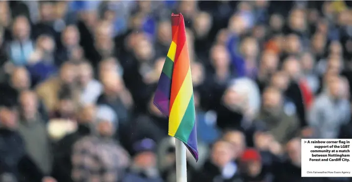  ?? Chris Fairweathe­r/Huw Evans Agency ?? > A rainbow corner flag in support of the LGBT community at a match between Nottingham Forest and Cardiff City.