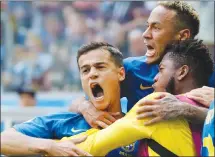  ?? Associated Press photo ?? Brazil's Philippe Coutinho, left, celebrates scoring his side's opening goal with Neymar, top, and teammates during the group E match between Brazil and Costa Rica at the 2018 soccerWorl­d Cup in the St. Petersburg Stadium in St. Petersburg, Russia,...