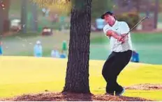  ?? AFP ?? Patrick Reed plays his second shot on the 17th hole during the second round yesterday.