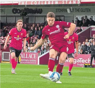  ?? ?? Arbroath’s Michael Mckenna powers the ball home from the spot