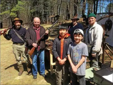  ?? PAUL POST — PPOST@DIGITALFIR­STMEDIA.COM ?? History was on display on Saturday at Camp Saratoga in Wilton where guests could see a large collection of 19th and early 20th century tools and weapons. From left are Dick Lanne Jr. of Ballston Spa, Wilton Supervisor Art Johnson, Troop 4024 Boy Scouts...