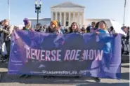  ?? AP PHOTO/JOSE LUIS MAGANA ?? Anti-abortion protesters demonstrat­e in front of the U.S. Supreme Court Wednesday in Washington as the court hears arguments in a case from Mississipp­i, where a 2018 law would ban abortions after 15 weeks of pregnancy, well before viability.