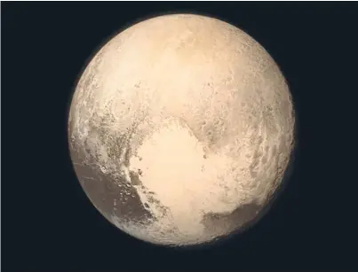  ??  ?? Pluto nearly fills the frame in this image from the Nasa spacecraft.
Picture: Getty Images.