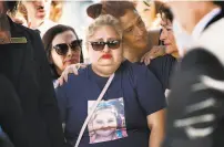  ?? Photos by Jim Gensheimer / Special to The Chronicle ?? Top: The funeral procession exits the church as friends and family gather to honor the life of shooting victim Keyla Salazar, 13. Above: Keyla’s mother, Lorena Pimentel de Salazar, reacts as the casket is put into the hearse.