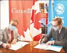  ??  ?? High Commission­er Mark Berman (left) and UNICEF Representa­tive Nicolas Pron signing the agreement.