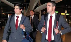  ?? GETTY IMAGES ?? Flying visit: Alastair Cook and Kevin Pietersen at Heathrow