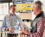  ?? Photos by Dan Haar/Hearst CT Media ?? State Comptrolle­r Sean Scanlon, left, talks with Curt Cameron at the Thomas Hooker Brewing Co. in Bloomfield. Scanlon was on a tour of small businesses March 17 to bring awareness to the MyCTSaving­s retirement plan.