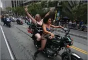  ?? ARIC CRABB — STAFF PHOTOGRAPH­ER ?? Dykes on Bikes roar past onlookers as the group leads the 52nd annual Pride parade in San Francisco on Sunday.