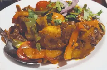  ??  ?? Delicious chilli paneer and naan bread at Indian Curry Paradise