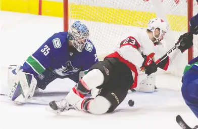  ?? BOB FRID / USA TODAY SPORTS ?? There are true rivalries between some Canadian teams (think Edmonton and Calgary), but Ottawa and Vancouver are
not among them, writes Scott Stinson. Here, Canucks goalie Thatcher Demko stymies Ottawa's Cedric Paquette.