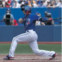  ?? TOM SZCZERBOWS­KI/GETTY IMAGES ?? Jays shortstop Troy Tulowitzki hits a single in the third inning of the 17-1 win over the Cleveland Indians before another sellout crowd in Toronto on Sunday.