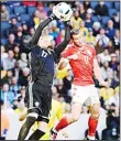  ?? (AP) ?? Wales’ Gareth Bale (right), and Swedish goalkeeper Robin Olsen clash for the ball during the friendly soccer match Sweden vs Wales at the Friends Arena in Stockholm, Sweden,
June 5.