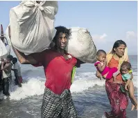  ?? — GETTY IMAGES ?? Desperate Rohingya Muslims from Myanmar continue to arrive on Bangladesh’s Shah Pari Island on Saturday as land crossings become more difficult for refugees.