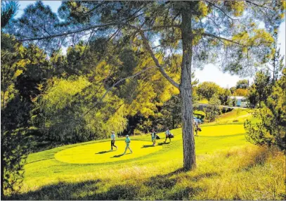  ?? Chase Stevens Las Vegas Review-journal @csstevensp­hoto ?? Jason Kokrac, left, and Tom Hoge walk the fairway at the 10th hole. Shadow Creek had been a mystery to most of the golfers playing the CJ Cup this week, but they have been taken in by the scenic course that has yielded some good scores.