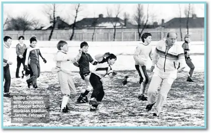 ??  ?? Bobby Charlton with youngsters at Soccer School, Monkton Stadium, Jarrow, February 1986