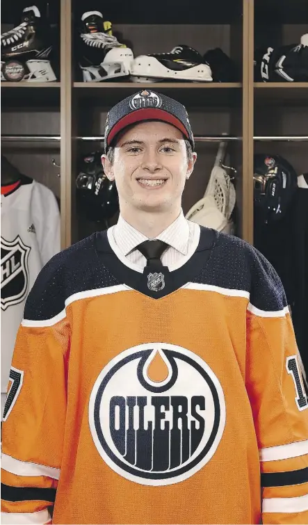  ?? STACY REVERE/GETTY IMAGES ?? Kailer Yamamoto sported Oilers’ colours after being taken with the 22nd overall pick in Friday’s NHL entry draft in Chicago, but it is likely to be a couple of seasons before he wears the jersey again.