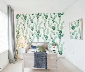  ??  ?? This room has bright and funky green-patterned wallpaper that’s repeated in framed artwork on the wall.