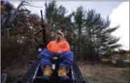  ?? CHARLES KRUPA — THE ASSOCIATED PRESS ?? Paraplegic hunter Gary Dupuis of Ashburnham, Mass., waits in his all-terrain wheelchair, equipped with a shooting rack for his shotgun, while deer hunting in Devens, Mass., last week.