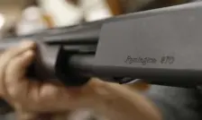  ?? AP FILE ?? ‘CONSIDER YOUR MAN CARD REISSUED’: The Remington name is seen etched on a model 870 shotgun at Duke’s Sport Shop in New Castle, Pa. A lawsuit claims the company marketed guns to younger, at-risk men.