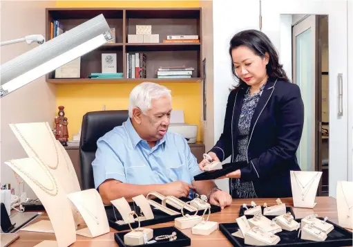  ??  ?? TRUE PARTNERS. F&amp;C patriarch Florete and trusted lieutenant, daughter Marissa Florete- Gorriceta examine some baubles from their latest collection