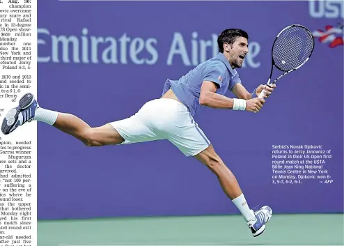  ?? — AFP ?? Serbia’s Novak Djokovic returns to Jerzy Janowicz of Poland in their US Open first round match at the USTA Billie Jean King National Tennis Centre in New York on Monday. Djokovic won 63, 5-7, 6-2, 6-1.