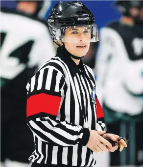  ?? JEFF MCINTOSH / THE CANADIAN PRESS FILES ?? Referee Erica Holmes officiates a game at the Mac’s Tournament in Calgary last month.