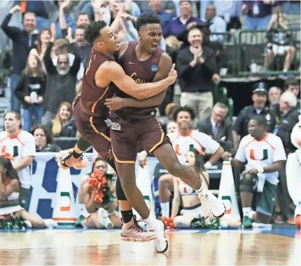  ?? TIM HEITMAN/USA TODAY SPORTS ?? Marques Townes, left, and Donte Ingram celebrate Loyola’s NCAA tournament win Thursday against the Miami Hurricanes.