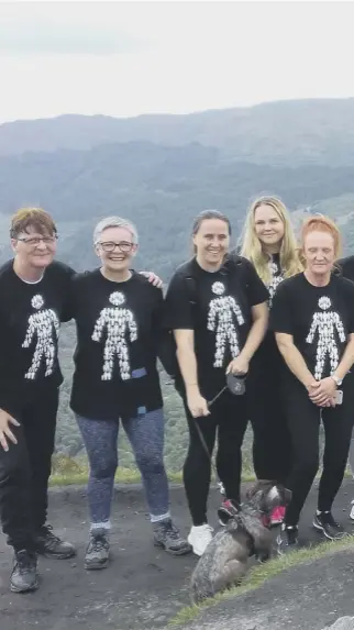  ??  ?? 0 Betting shop staff like these workers for William Hill, who walked up Ben A’an in the Trossachs to raise funds for Prostate Cancer UK, carry out important work for charities and campaigns, says Donald Morrison