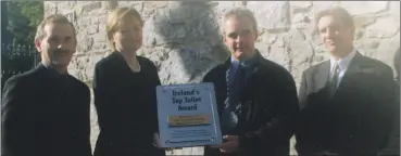  ?? ?? Lismore Mayor, Cllr John Campion, accepting the ‘Top Toilet Award’ from Pharmacia representa­tive Anne McWilliams, outside the town’s public toilets in October 2002. Also included are Lismore town clerk, Eric Flynn and area engineer, Noel Healy.