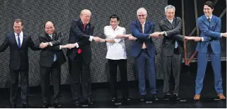  ?? NOEL CELIS, THE ASSOCIATED PRESS ?? From left: Russian Prime Minister Dmitry Medvedev, Vietnamese Prime Minister Nguyen Xuan Phuc, U.S. President Donald Trump, Philippine President Rodrigo Duterte, Australian Prime Minister Malcolm Turnbull, Singapore Prime Minister Lee Hsien Loong and...