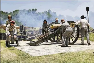  ?? CONTRIBUTE­D BY NATIONAL PARK SERVICE ?? Civil War re-enactors fire a cannon in Vicksburg, Miss.