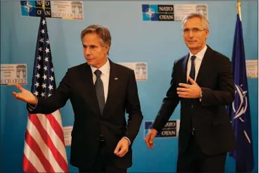  ?? (AP/Vadim Ghirda) ?? U.S. Secretary of State Antony Blinken (left) meets with NATO Secretary-General Jens Stoltenber­g during a gathering of NATO officials Tuesday in Bucharest, Romania.